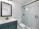 Modern bathroom features a tiled shower with glass door and vanity with storage at 4035 Hosch Retreat Dr, Buford, GA 30519