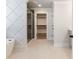 Modern bathroom with a glass shower, and access to a walk-in closet at 4035 Hosch Retreat Dr, Buford, GA 30519