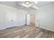 Spacious bedroom features a coffered ceiling, wood-look floors, and double closets at 4035 Hosch Retreat Dr, Buford, GA 30519