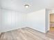 A bright bedroom featuring stylish wood-look floors and modern wainscoting at 4035 Hosch Retreat Dr, Buford, GA 30519
