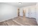 Bedroom featuring wood-look floors and access to the ensuite bath and closet at 4035 Hosch Retreat Dr, Buford, GA 30519