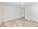 Bedroom featuring wood-look floors and access to the ensuite bath and closet at 4035 Hosch Retreat Dr, Buford, GA 30519