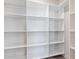 Walk-in closet featuring a white shelving system with ample storage space at 4035 Hosch Retreat Dr, Buford, GA 30519