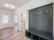 Inviting entryway features coat rack with bench, and a view of the hallway at 4035 Hosch Retreat Dr, Buford, GA 30519