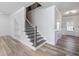 Inviting entryway with natural light, features a staircase and convenient built-in shelving at 4035 Hosch Retreat Dr, Buford, GA 30519