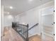 Spacious hallway with modern railings providing access to bedrooms at 4035 Hosch Retreat Dr, Buford, GA 30519