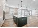 Well-designed kitchen with stainless steel appliances, a center island, and seamless sight lines at 4035 Hosch Retreat Dr, Buford, GA 30519