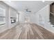 Bright living room features a fireplace, built-in shelving, and doors to the patio at 4035 Hosch Retreat Dr, Buford, GA 30519