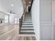 Elegant staircase enhances the home's charm with its modern design and neutral palette at 4035 Hosch Retreat Dr, Buford, GA 30519