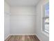 Walk-in closet features a window and a wall-mounted metal shelving system at 4035 Hosch Retreat Dr, Buford, GA 30519