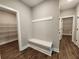Functional mud room with a bench, coat rack, and access to walk-in closets for storage at 476 Benson Meadows Dr, Dallas, GA 30157