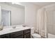 Bathroom featuring a single sink vanity and a shower with a curtain at 7554 Roseberry Way, Lithonia, GA 30038