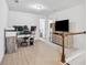 Versatile upstairs loft space with neutral carpeting and natural light perfect for office or den at 7554 Roseberry Way, Lithonia, GA 30038