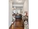 Welcoming foyer with hardwood floors, coffered ceilings, a staircase, and decorative accents at 7554 Roseberry Way, Lithonia, GA 30038