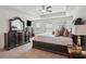 Bright main bedroom with a ceiling fan and carpeted floor at 7554 Roseberry Way, Lithonia, GA 30038