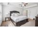Spacious bedroom featuring a large window and a ceiling fan at 7554 Roseberry Way, Lithonia, GA 30038