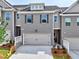 Beautiful townhouse with a two-car garage, gray brick, and charming curb appeal at 1347 Fern Ridge Ct # 29, Norcross, GA 30093