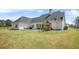 Large backyard with a play set and a covered patio area, ideal for outdoor activities and relaxation at 20 Tuscany Dr, Mansfield, GA 30055