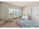 Cozy bedroom with a large window, plush carpet, and ample natural light at 20 Tuscany Dr, Mansfield, GA 30055