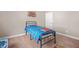 Cozy bedroom with Spiderman themed decor, new carpet, and neutral color palette at 20 Tuscany Dr, Mansfield, GA 30055