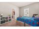 Comfortable bedroom with Spiderman themed bedding and decor leading to a closet at 20 Tuscany Dr, Mansfield, GA 30055