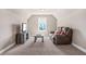 Cozy bonus room with neutral walls, carpet, a comfortable sofa, and a TV, creating a perfect relaxing space at 20 Tuscany Dr, Mansfield, GA 30055