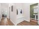 Hallway featuring built-in storage, easy access to bathroom, and seamless design at 20 Tuscany Dr, Mansfield, GA 30055