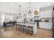 Bright kitchen features granite counters, stainless appliances, and large center island at 20 Tuscany Dr, Mansfield, GA 30055