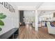 Open-concept living room with hardwood floors, fireplace, and abundant natural light at 20 Tuscany Dr, Mansfield, GA 30055