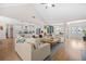 Spacious living room with an open floorplan and views into the kitchen, dining room and covered porch at 20 Tuscany Dr, Mansfield, GA 30055
