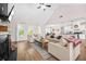 Bright and spacious living room with a cozy fireplace and an open floorplan with sightlines to the kitchen at 20 Tuscany Dr, Mansfield, GA 30055