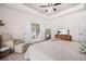 Spacious main bedroom with connecting bathroom and comfortable seating area at 20 Tuscany Dr, Mansfield, GA 30055