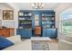 Cozy home office with custom shelving, built-in desk, and ample storage space at 20 Tuscany Dr, Mansfield, GA 30055