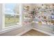 Walk-in pantry with open shelving and window provides ample storage space at 20 Tuscany Dr, Mansfield, GA 30055