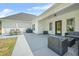 Outdoor patio with cozy seating, a grill, and ample space for entertaining friends and Gathering at 20 Tuscany Dr, Mansfield, GA 30055
