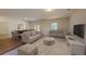 Spacious living area with hardwood floors, comfortable sofas, and lots of natural light at 206 Silverton Dr, Dacula, GA 30019