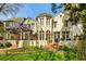 Charming home featuring a backyard with lush lawn, pergola with wisteria, and a patio area ideal for outdoor living at 41 Palisades Ne Rd, Atlanta, GA 30309