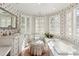 Charming bathroom featuring floral wallpaper, natural light, and vanity at 41 Palisades Ne Rd, Atlanta, GA 30309
