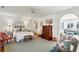 Spacious bedroom featuring a comfortable bed, sitting area, and bright natural light at 41 Palisades Ne Rd, Atlanta, GA 30309