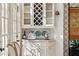 Charming butler's pantry with wine rack and decorative accents at 41 Palisades Ne Rd, Atlanta, GA 30309