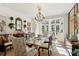 Formal dining room with chandelier and glass doors leading to the patio at 41 Palisades Ne Rd, Atlanta, GA 30309