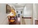 Bright hallway with pictures, hardwood floors, and staircase at 41 Palisades Ne Rd, Atlanta, GA 30309