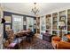 Charming home office with custom bookshelves, wainscoting, and natural light at 41 Palisades Ne Rd, Atlanta, GA 30309