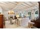 Bright living room with white beamed ceiling, fireplace, and arched windows at 41 Palisades Ne Rd, Atlanta, GA 30309