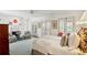 Spacious main bedroom with seating area, fireplace, and doors to outside at 41 Palisades Ne Rd, Atlanta, GA 30309