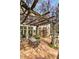 Outdoor patio featuring a vine-covered pergola and dining area at 41 Palisades Ne Rd, Atlanta, GA 30309