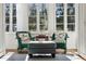 Bright sunroom featuring white trim, large windows, and comfortable seating at 41 Palisades Ne Rd, Atlanta, GA 30309