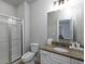 Bright bathroom with granite counters, vanity, and glass enclosed shower at 4845 Josie Way, Acworth, GA 30101