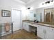 Bright bathroom features granite countertops, double sinks, white cabinets and a decorative rug at 4845 Josie Way, Acworth, GA 30101