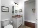 Bright bathroom features a vanity with granite countertop and artwork hanging on the wall at 4845 Josie Way, Acworth, GA 30101